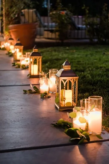 Create a light trail in each picture with the lanterns.