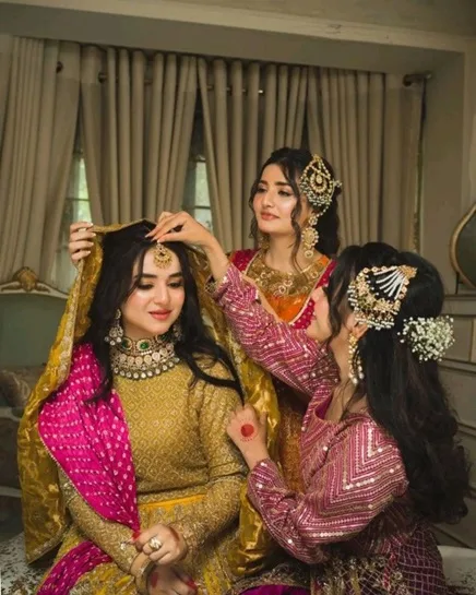 Gather your bridesmaids for a quick huddle shot.