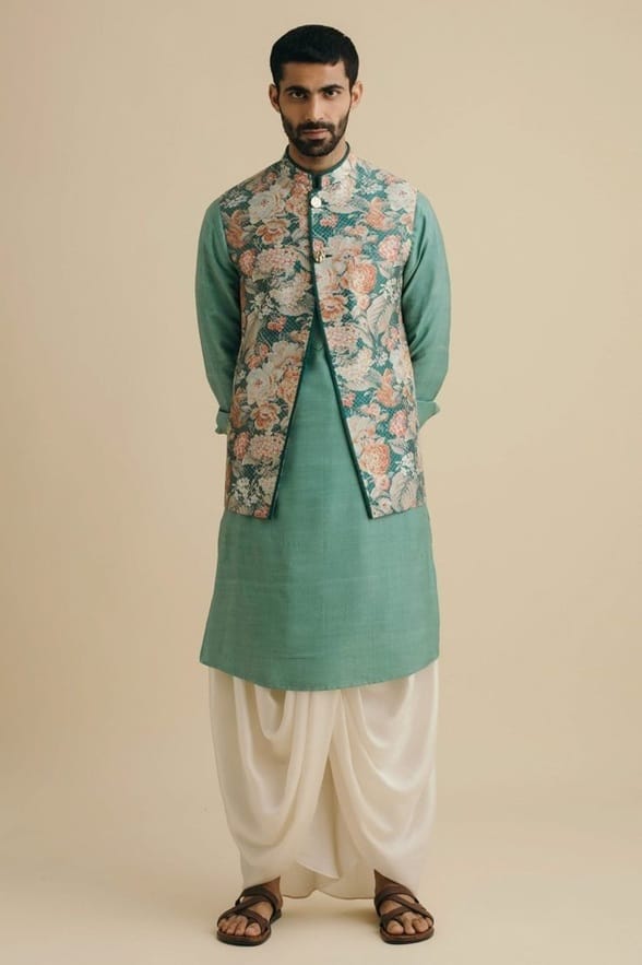 Team up your dhoti with a long kurta and jacket. 