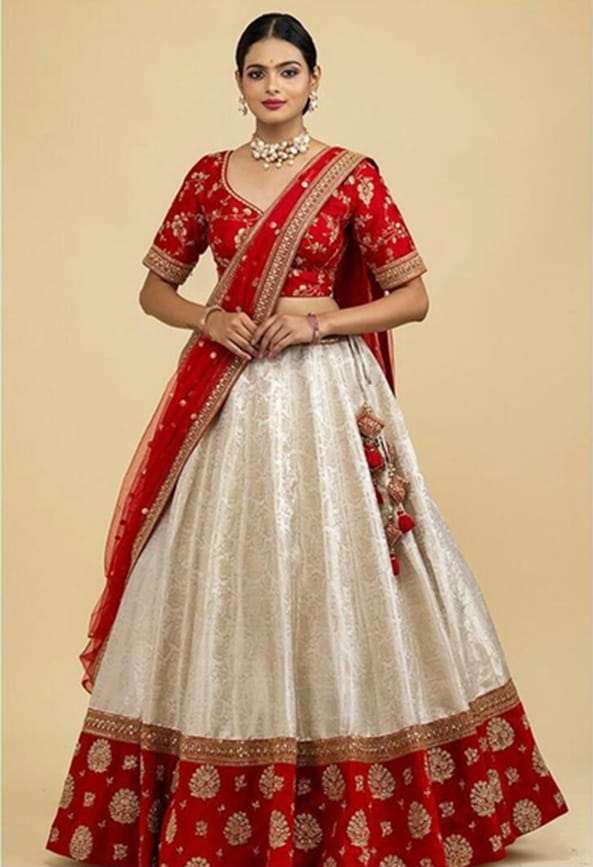 A red and white lehenga will help you add calmness to the chaos.