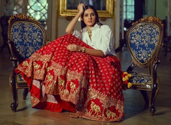 Pair your heavy, sparkly wedding lehenga skirt with a simple, modern crop top.