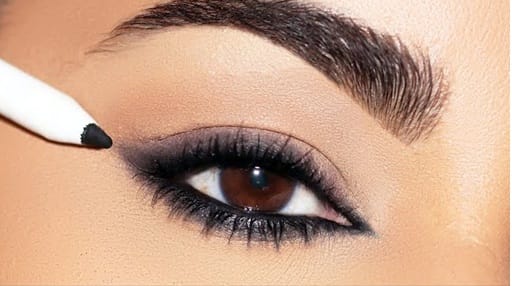 Brown and black on the tapering end of the eyes will make the eyes appear larger.