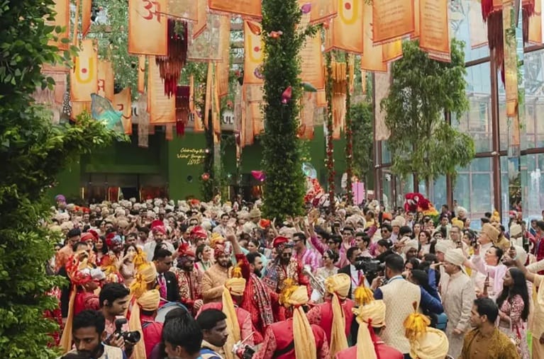 After the ritual, the groom heads to the venue, playing Dhol and dancing with the entire family.