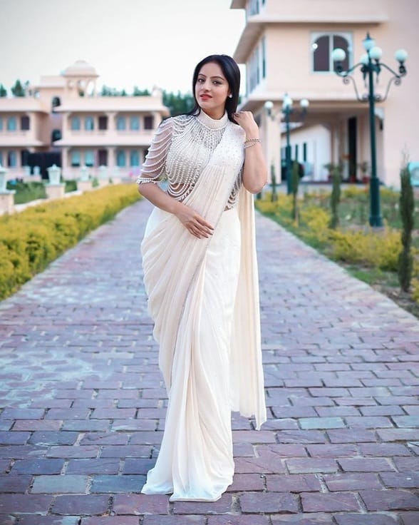 You can also choose a lightly embellished saree with a pearl cape to add the requisite bling for your Sangeet.