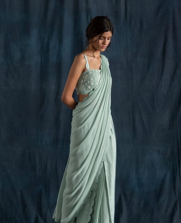 By choosing a scallop saree for your wedding, you can outsmart any criticism by showing how unique and modern you are.