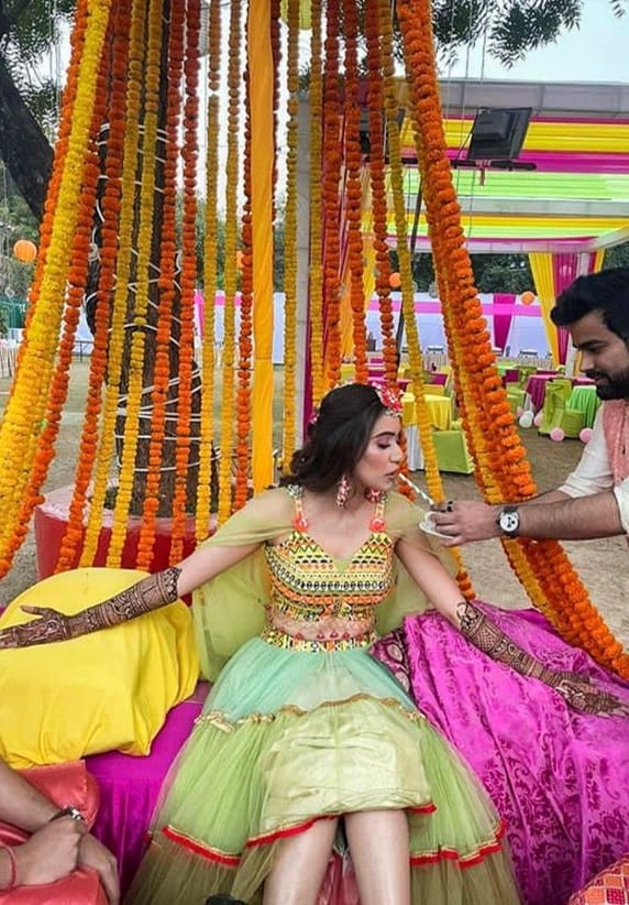During the mehendi ceremony, the bride adorns her hands and feet with intricate mehendi designs while the rest of her female family members join her.
