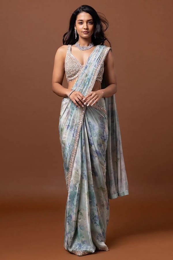 The pleats are arranged and stitched so that you can put on the saree like a dress.
